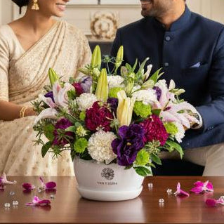 Blush of Desire carnations lilies lisianthus metal pot Bangalore delivery