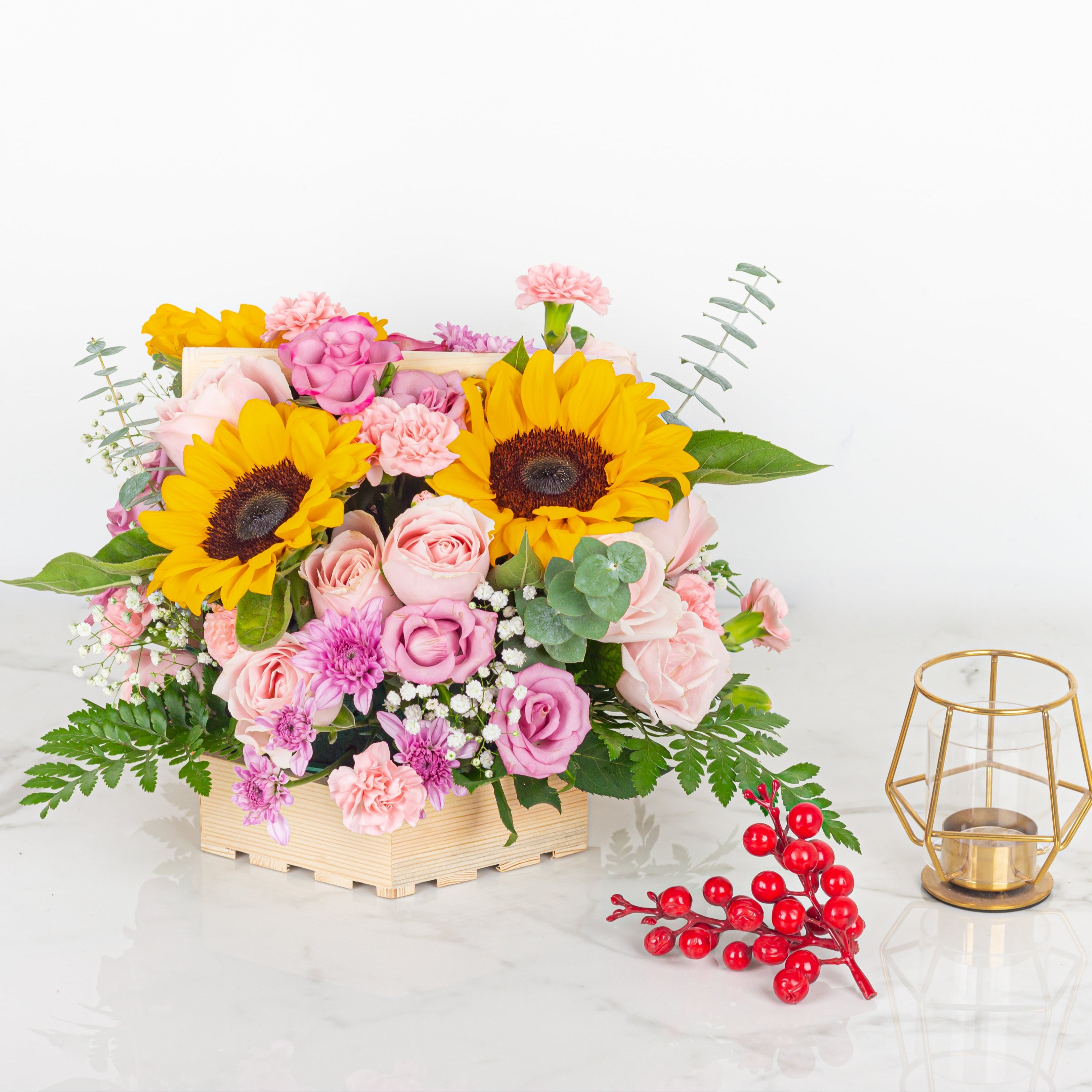 Bouquet of flowers with sunflowers and pink roses on a white background