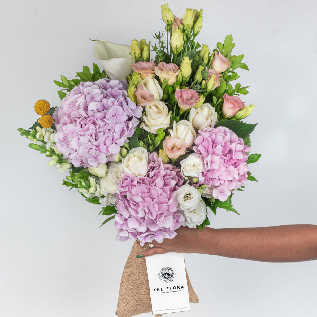 Bouquet of flowers with a visible brand tag on a light gray background