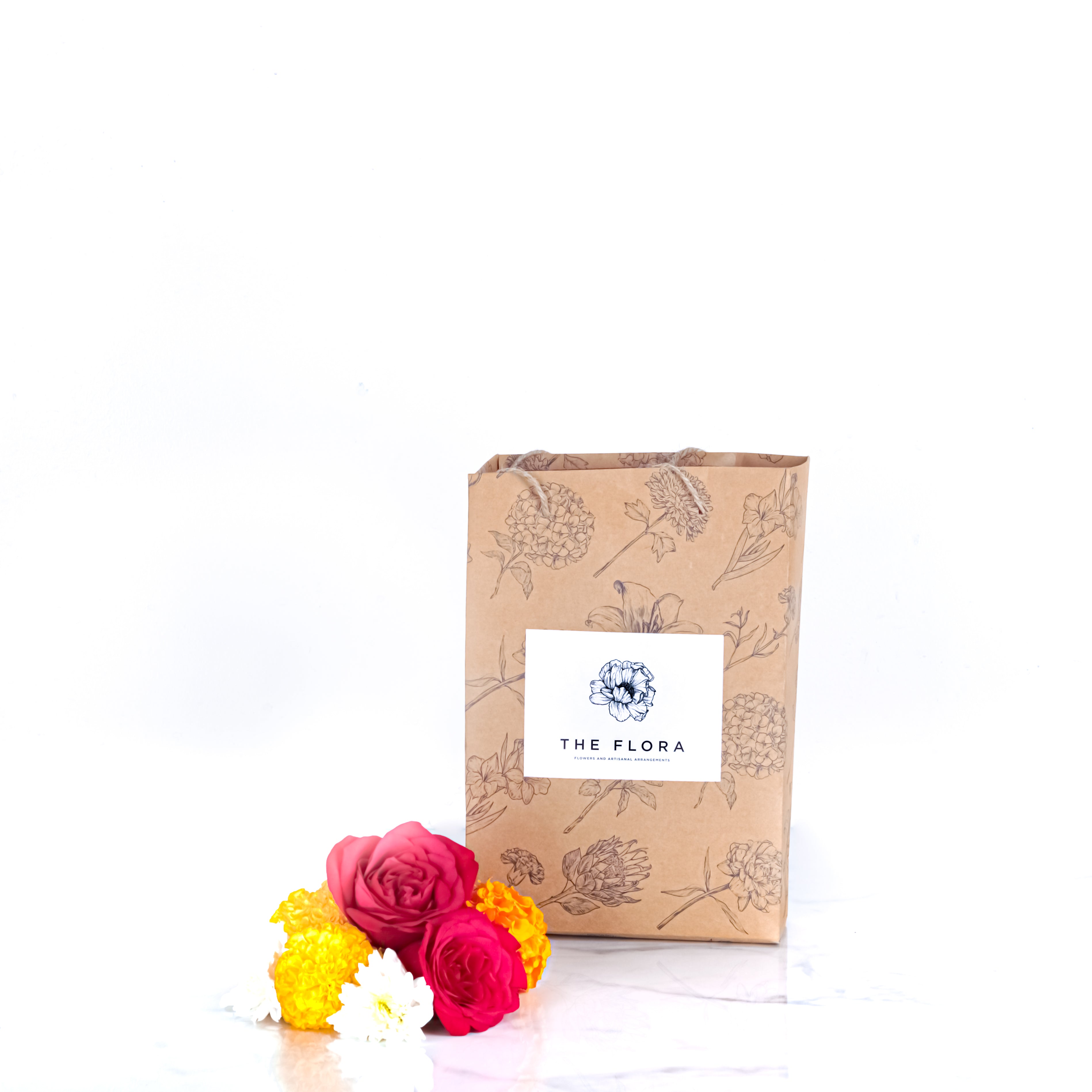 Festive Calm (Peace Lily with Puja flowers, Dried Apricots & Pecan nuts)