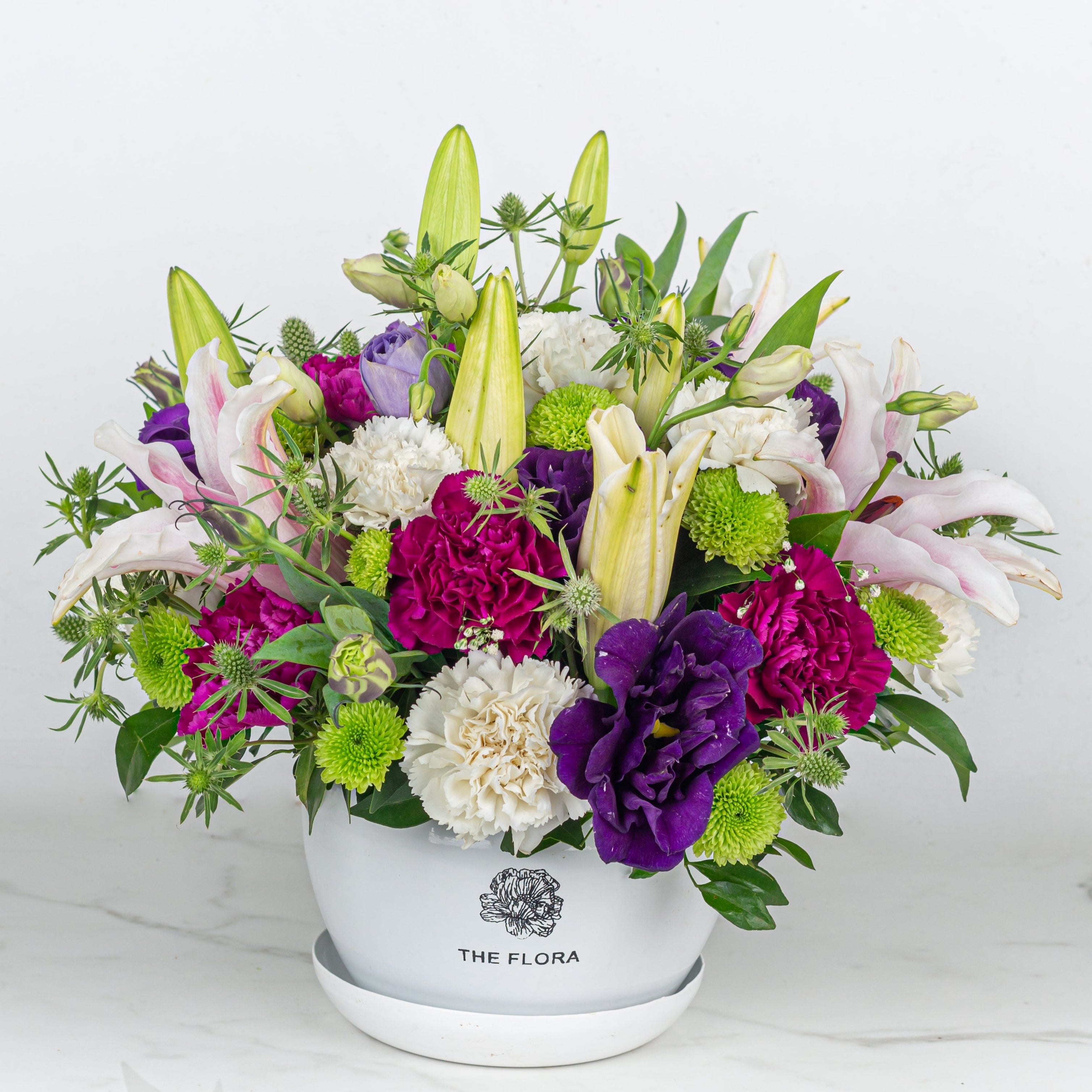 Blush of Desire carnations lilies lisianthus metal pot Bangalore delivery