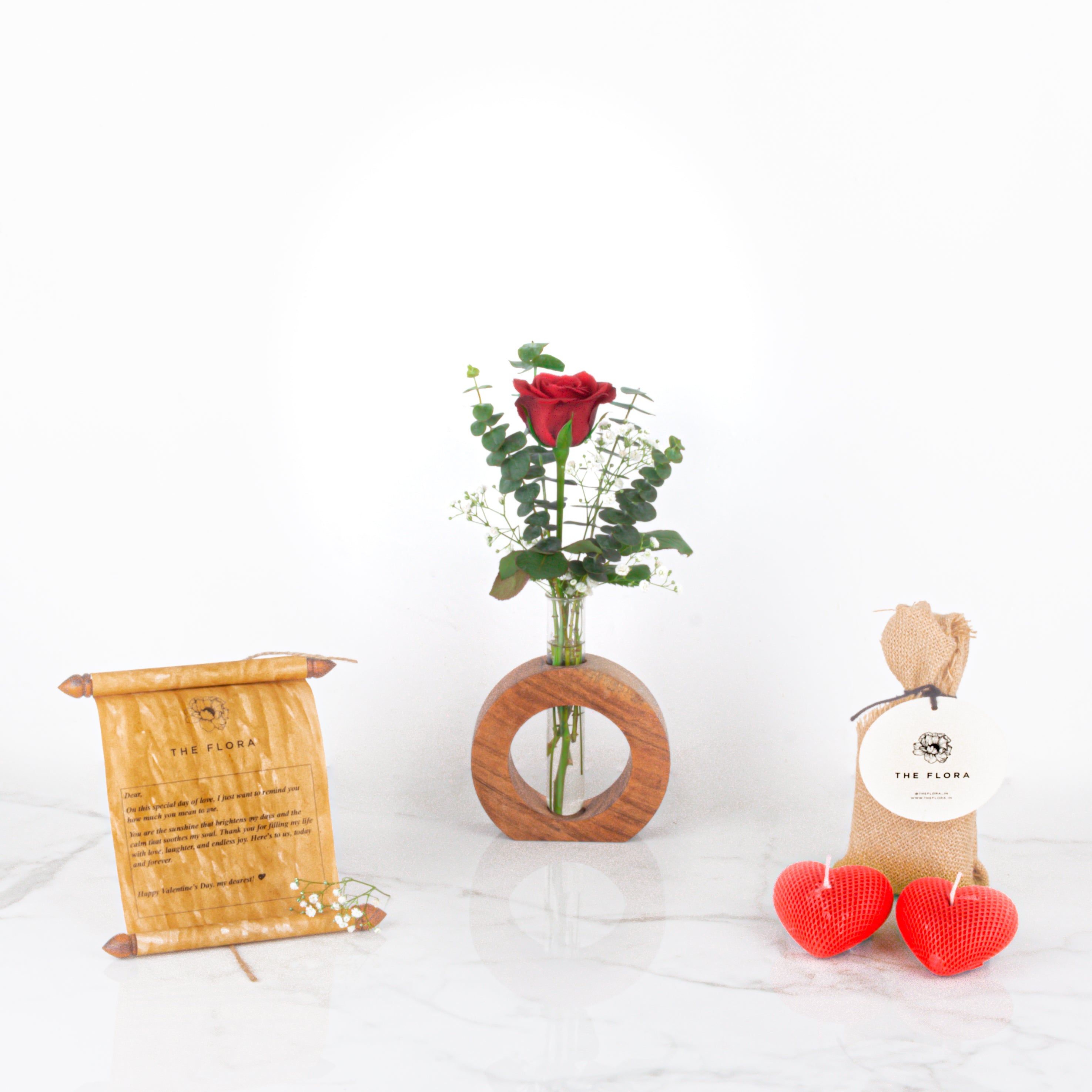 OneLove Wonder: Valentine’s Special Rose in a Wooden Stand with Scroll Message & Heart Candles