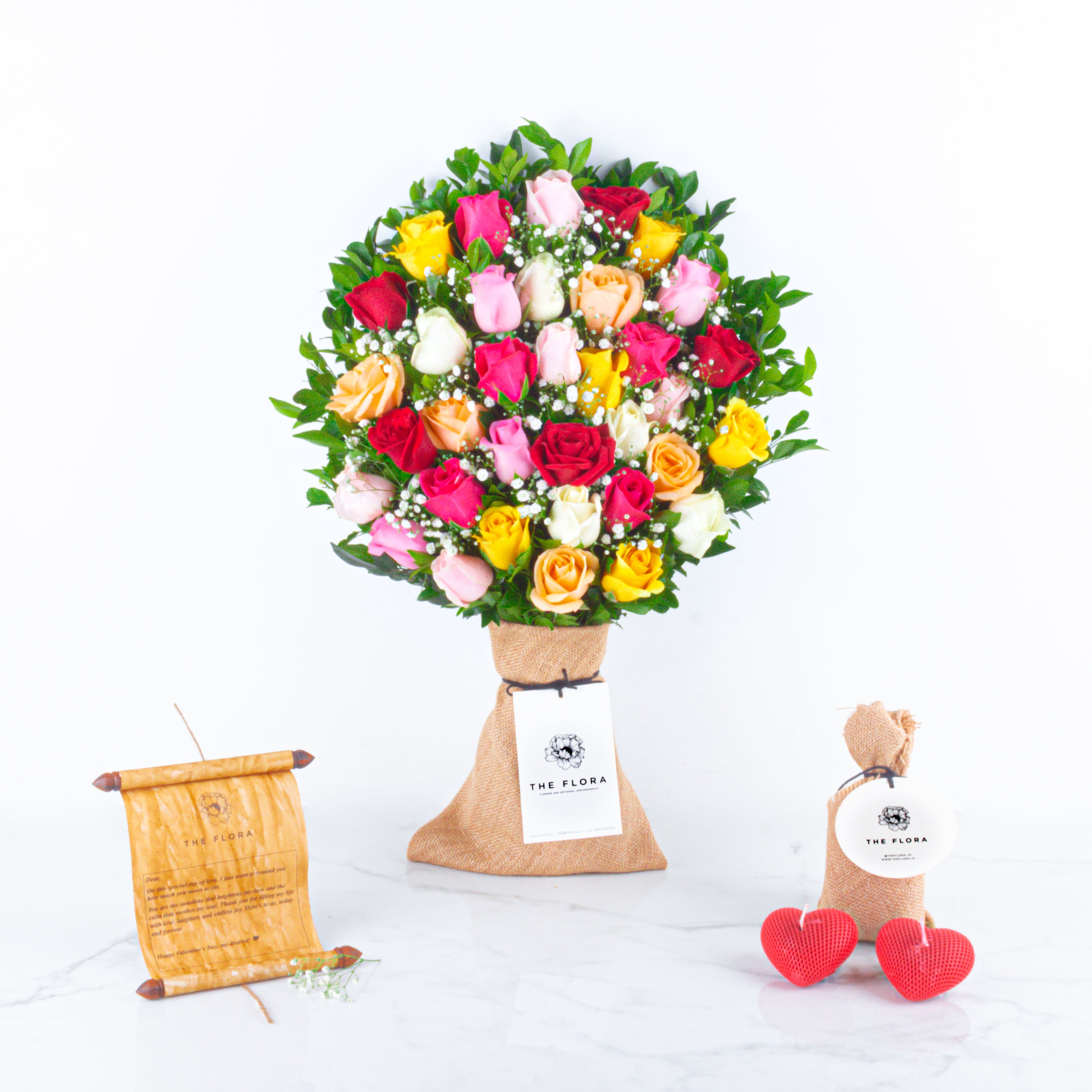 Rosy Embrace: Valentine’s Special Bouquet with Scroll Message & Heart Candles