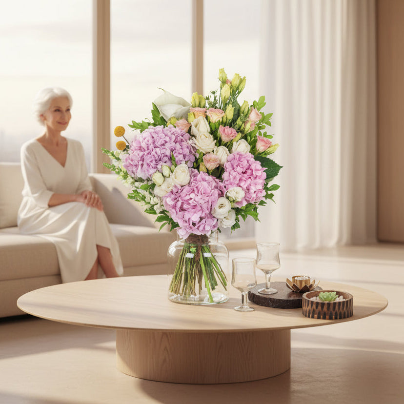 Bouquet of flowers in a clear vase on a white background
