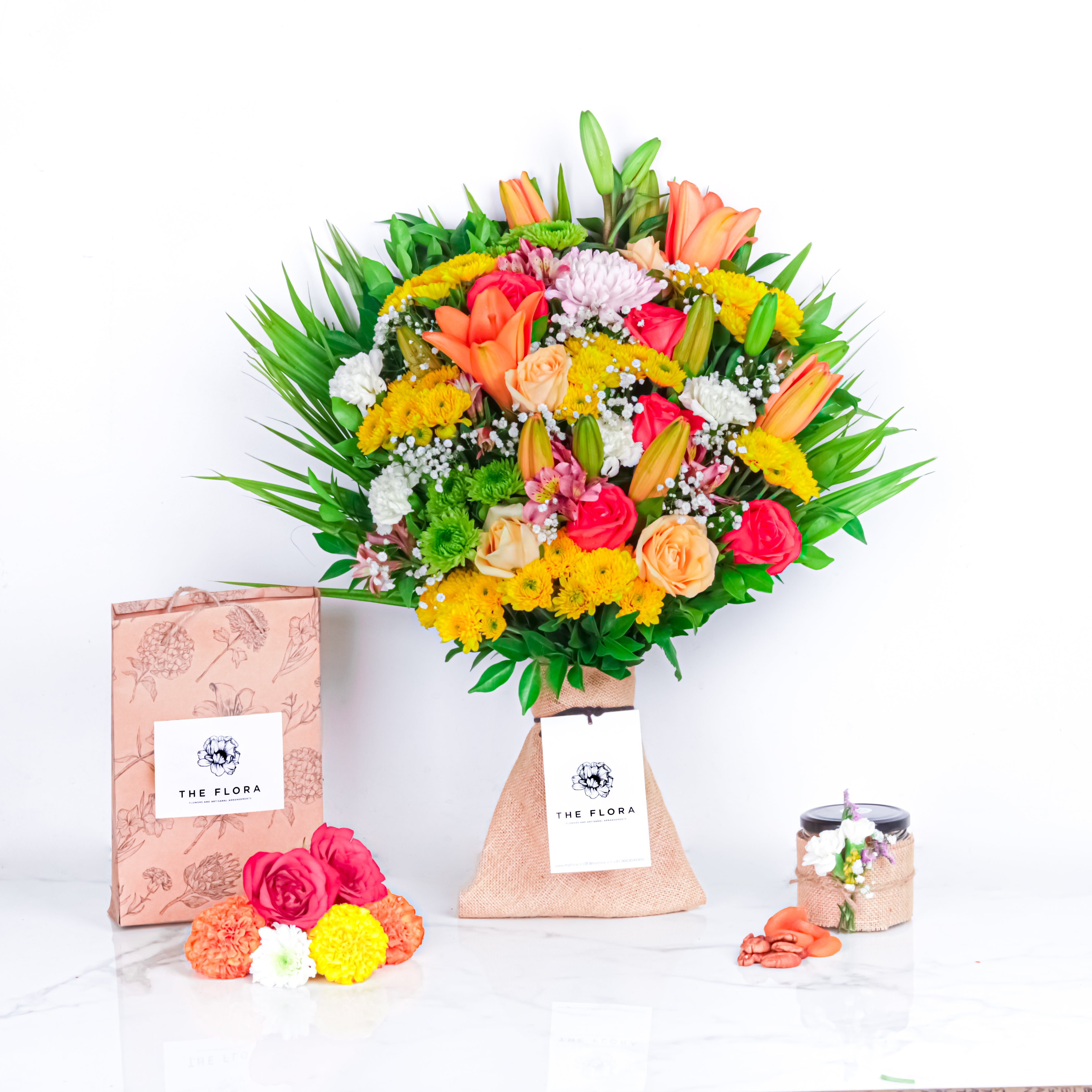 Diwali Floral Feast (Bouquet with Puja flowers, Dried Apricots & Pecan nuts)